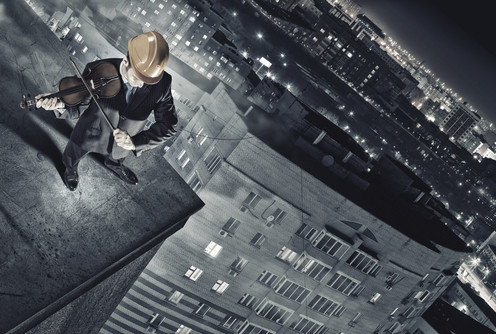 Top view of young businessman playing violin (foto: )